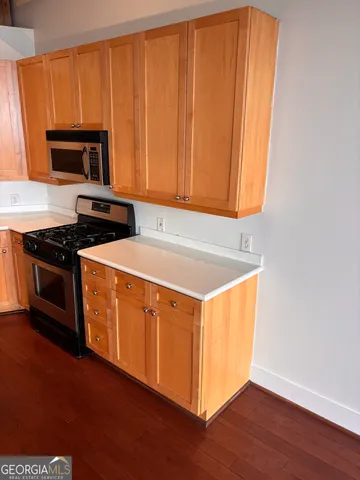 a kitchen with a sink and a window
