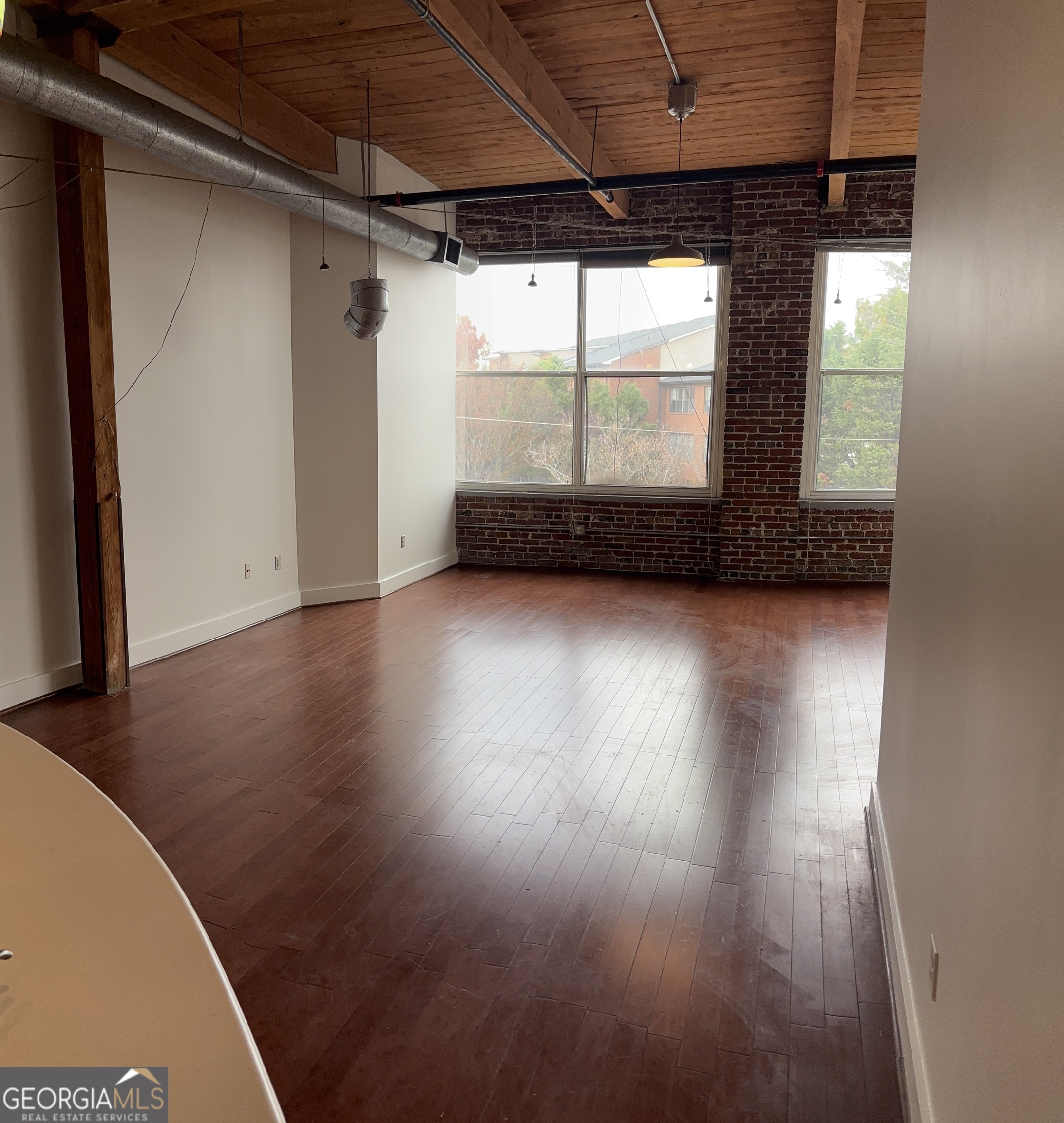 204 Walker Street Southwest Atlanta, GA 30313 - Photo 2 of 43 a view of a room with wooden floor and window