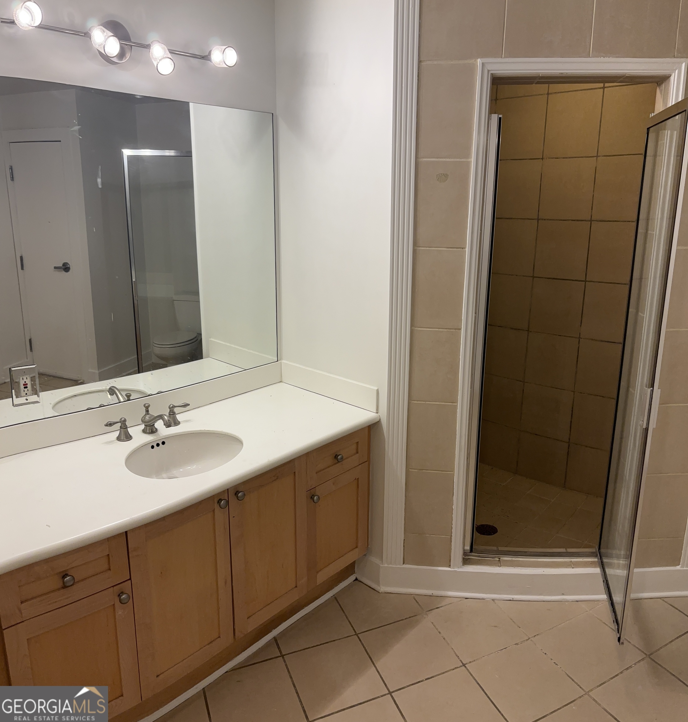204 Walker Street Southwest Atlanta, GA 30313 - Photo 24 of 43 a bathroom with a double vanity sink and a mirror