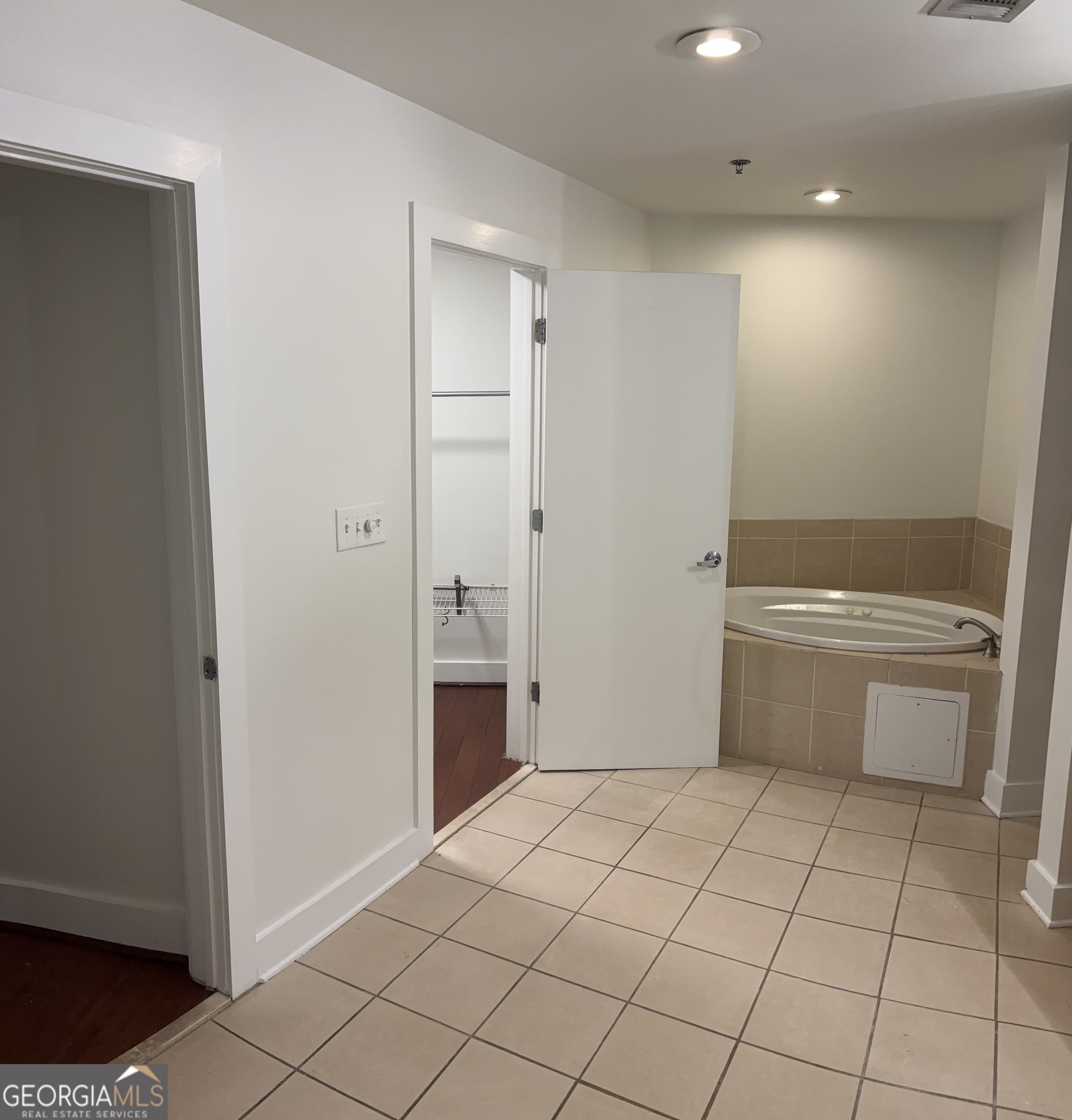 204 Walker Street Southwest Atlanta, GA 30313 - Photo 26 of 43 a bathroom with a sink a toilet and a mirror
