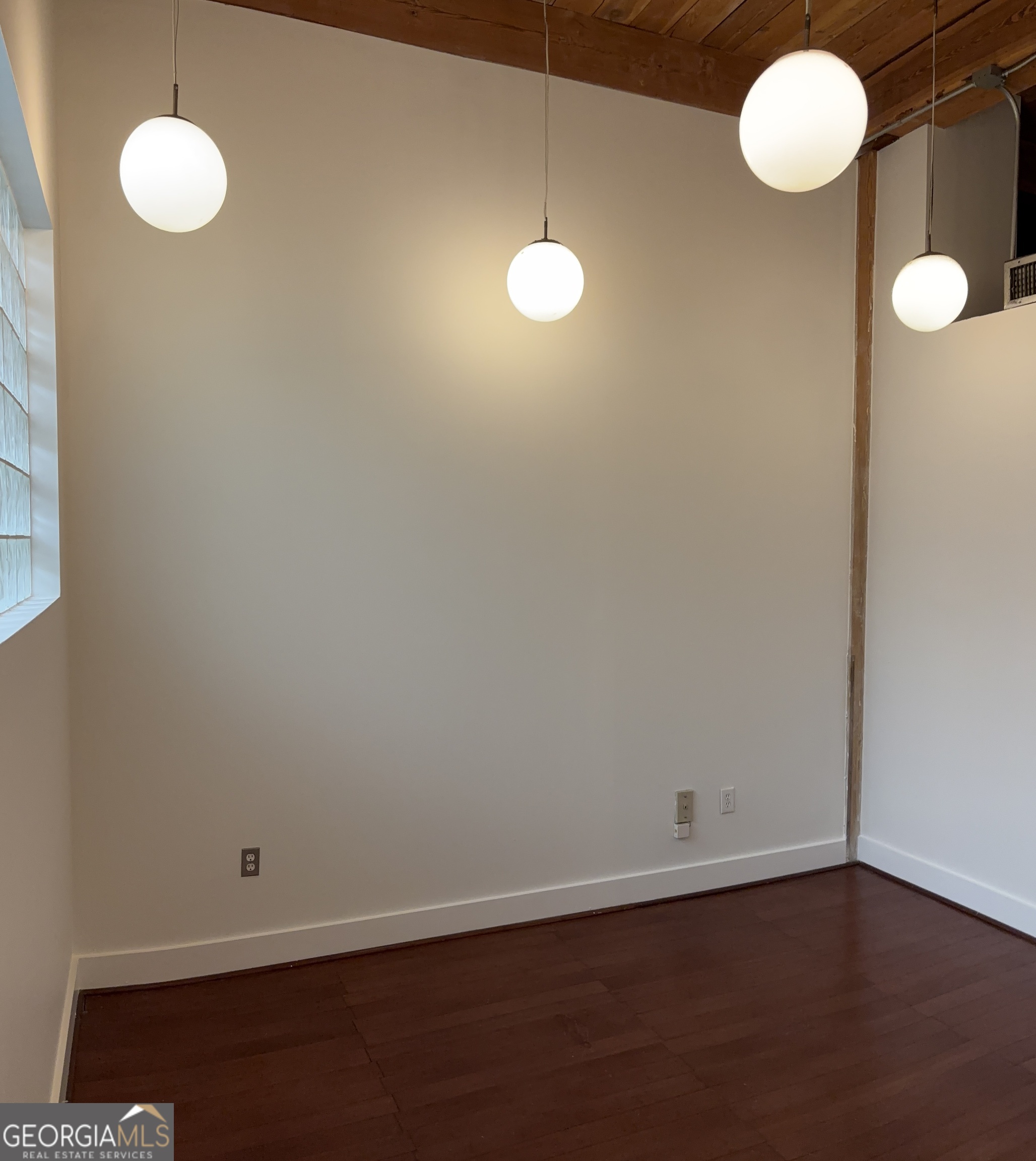 204 Walker Street Southwest Atlanta, GA 30313 - Photo 29 of 43 a view of a room with wooden floor and fan