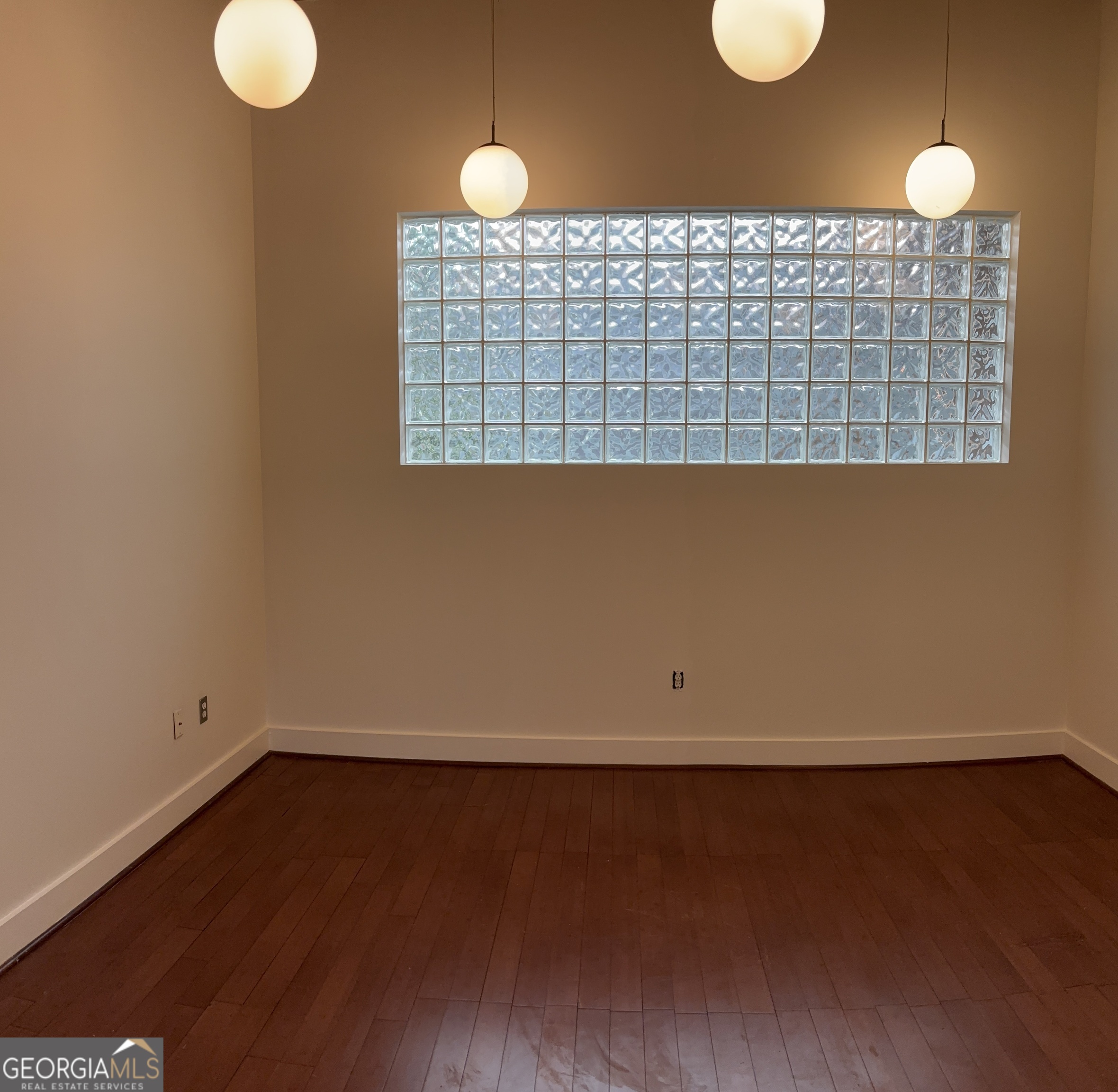 204 Walker Street Southwest Atlanta, GA 30313 - Photo 33 of 43 a view of an empty room with wooden floor