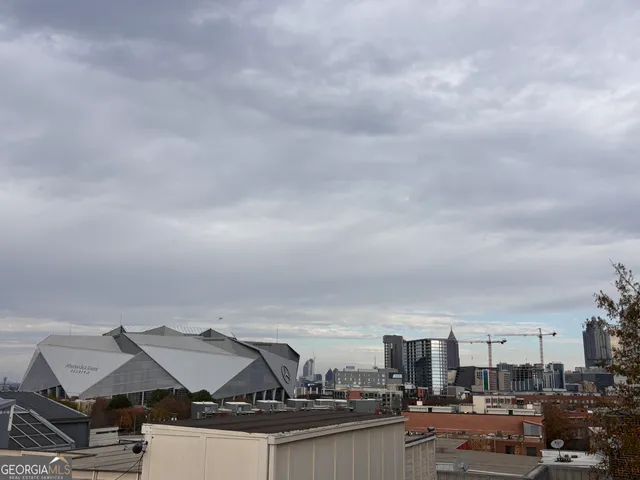 a view of a roof deck with patio
