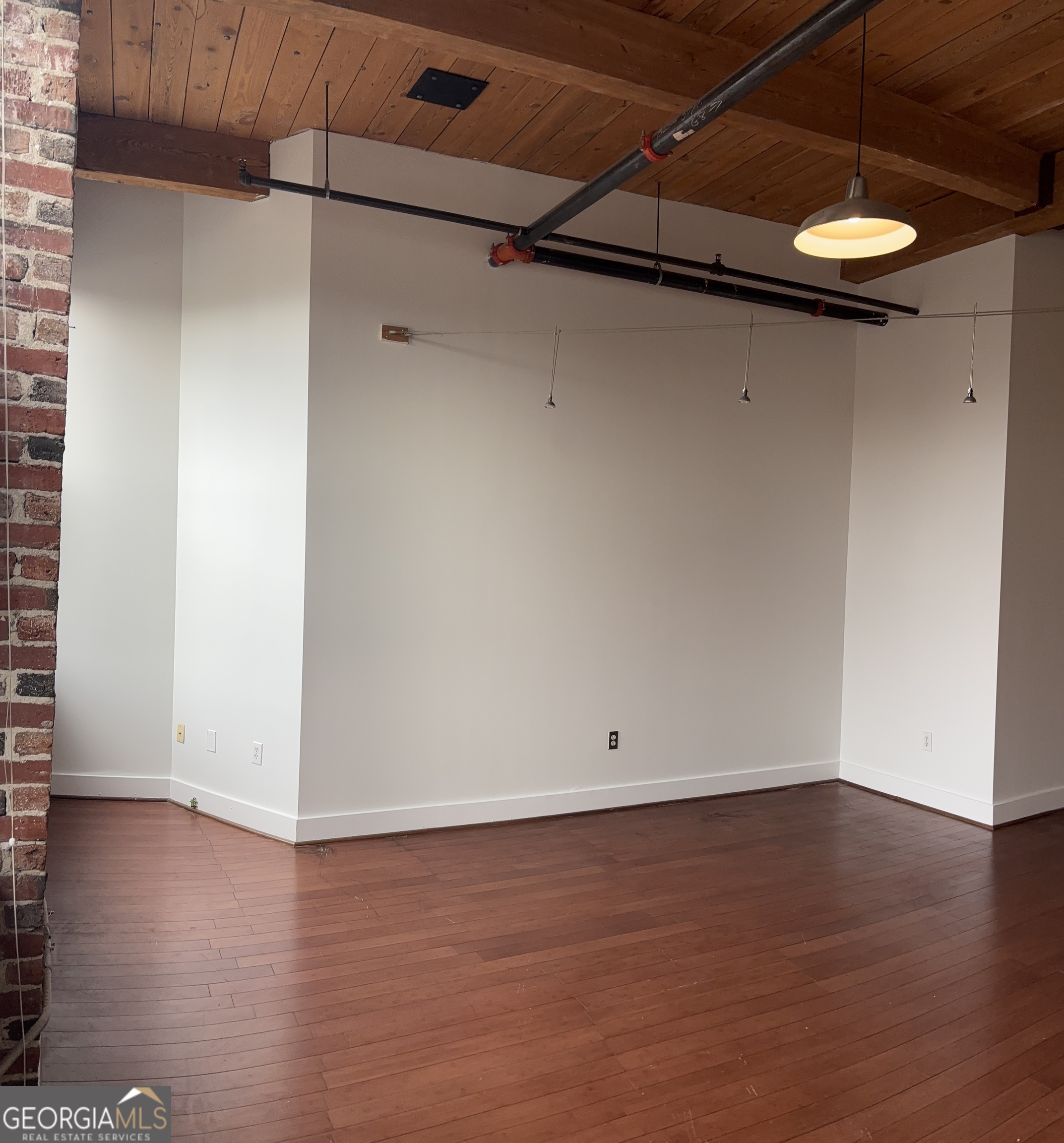 204 Walker Street Southwest Atlanta, GA 30313 - Photo 5 of 43 a view of a room with wooden floor