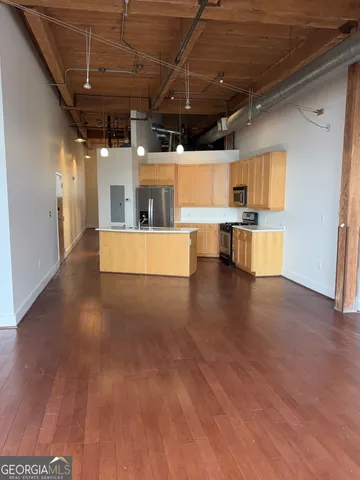 a view of a big room with wooden floors