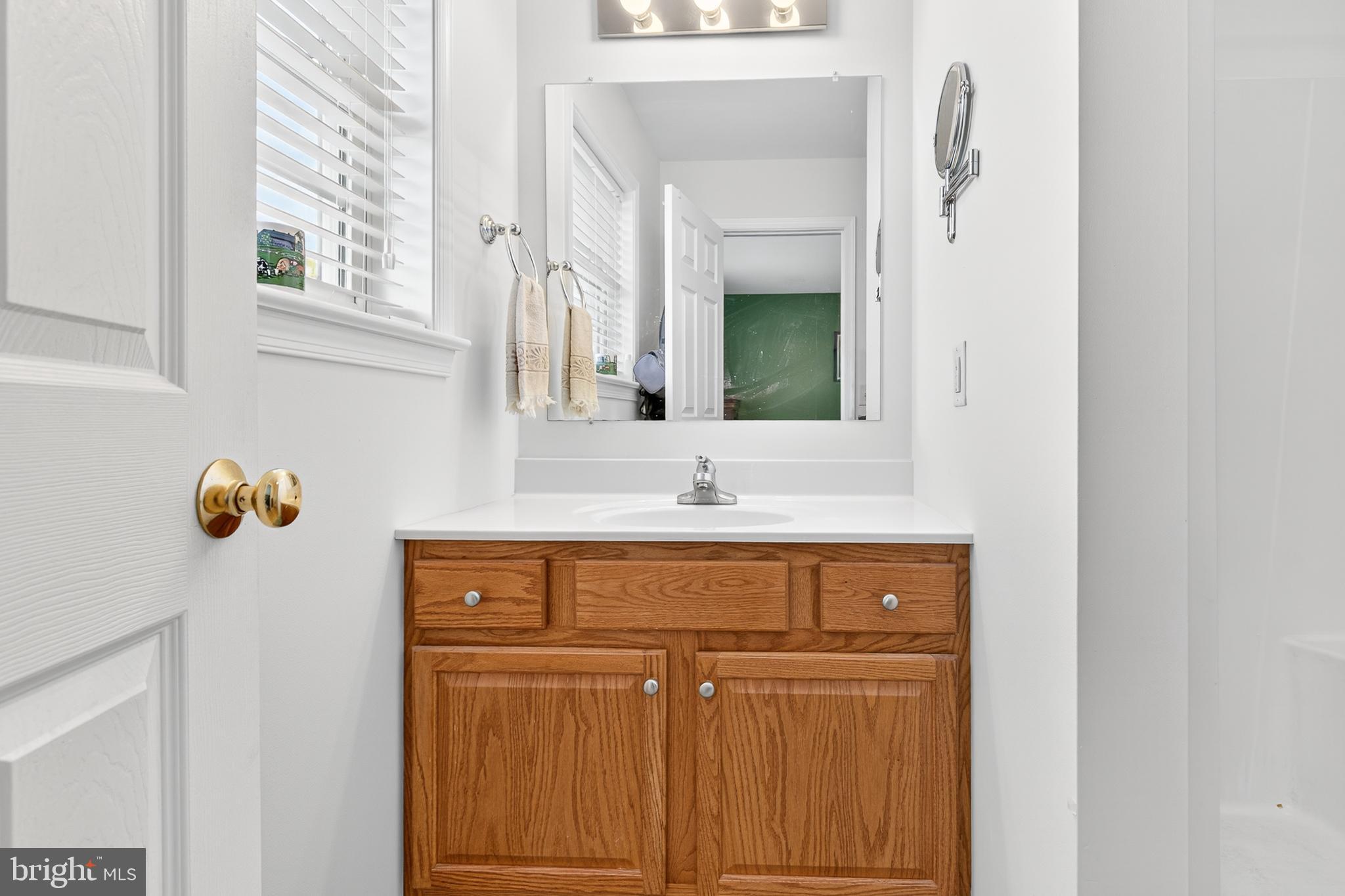 762 Keller Drive Lititz, PA 17543 - Photo 11 of 16 a bathroom with a sink and a mirror