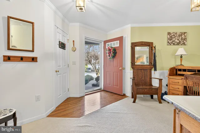 a view of livingroom with furniture and workspace