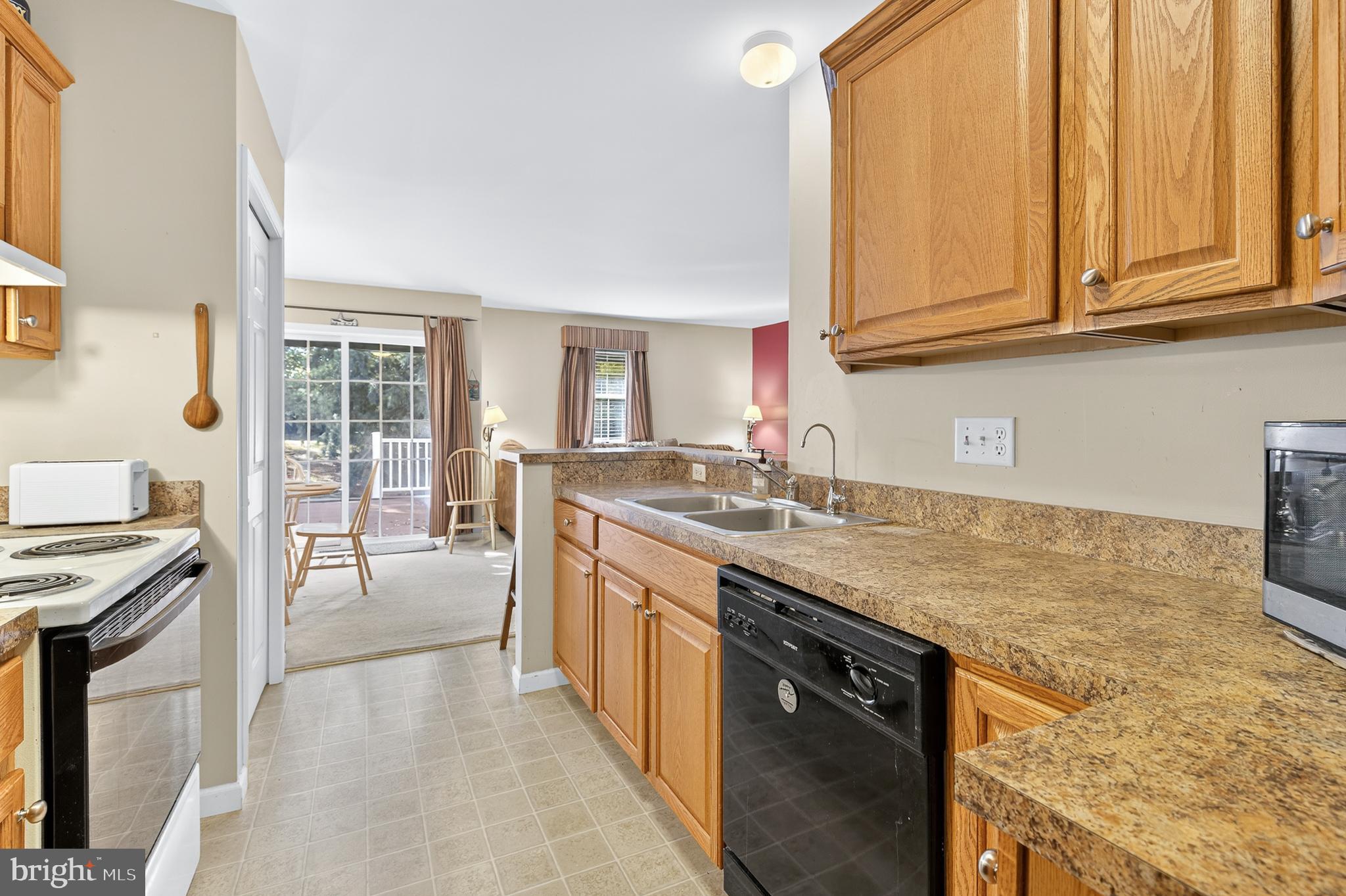762 Keller Drive Lititz, PA 17543 - Photo 8 of 16 a kitchen with stainless steel appliances granite countertop a sink stove and cabinets