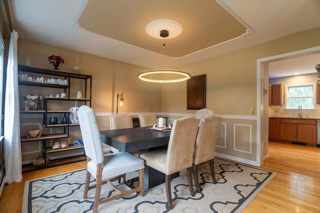 82 Hammersmith Drive Saugus, MA 01906 - Photo 13 of 42 a view of a dining room with furniture and wooden floor