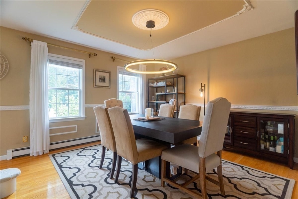 82 Hammersmith Drive Saugus, MA 01906 - Photo 14 of 42 a view of a dining room with furniture and wooden floor