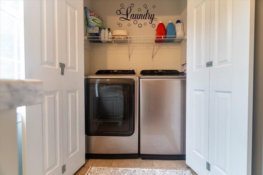 82 Hammersmith Drive Saugus, MA 01906 - Photo 17 of 42 a utility room with dryer and washer