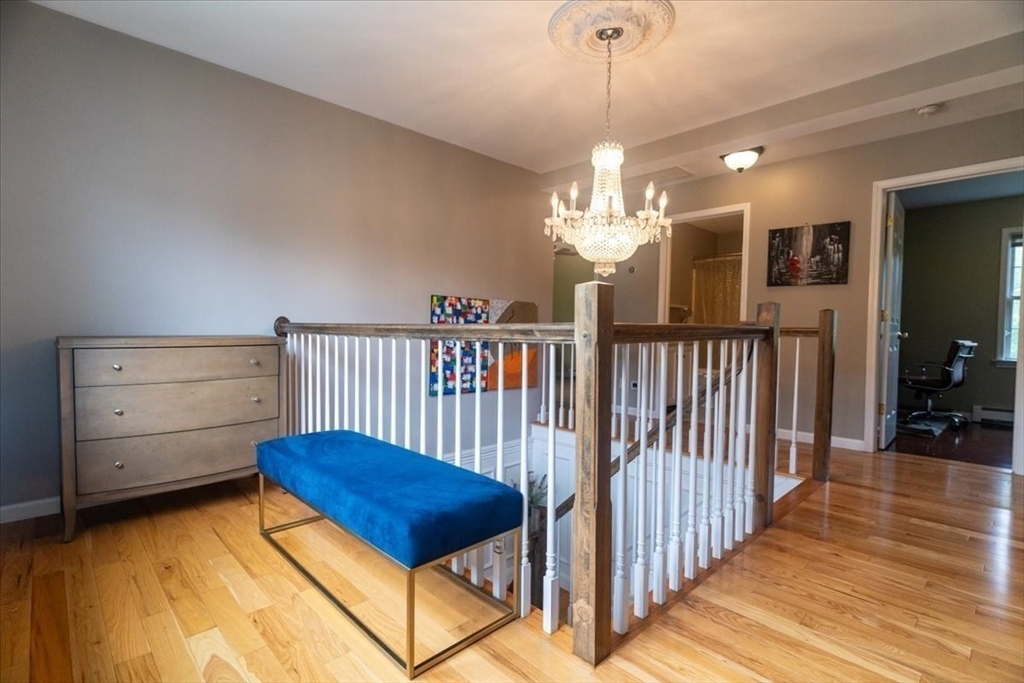 82 Hammersmith Drive Saugus, MA 01906 - Photo 20 of 42 a view of a room with furniture and wooden floor