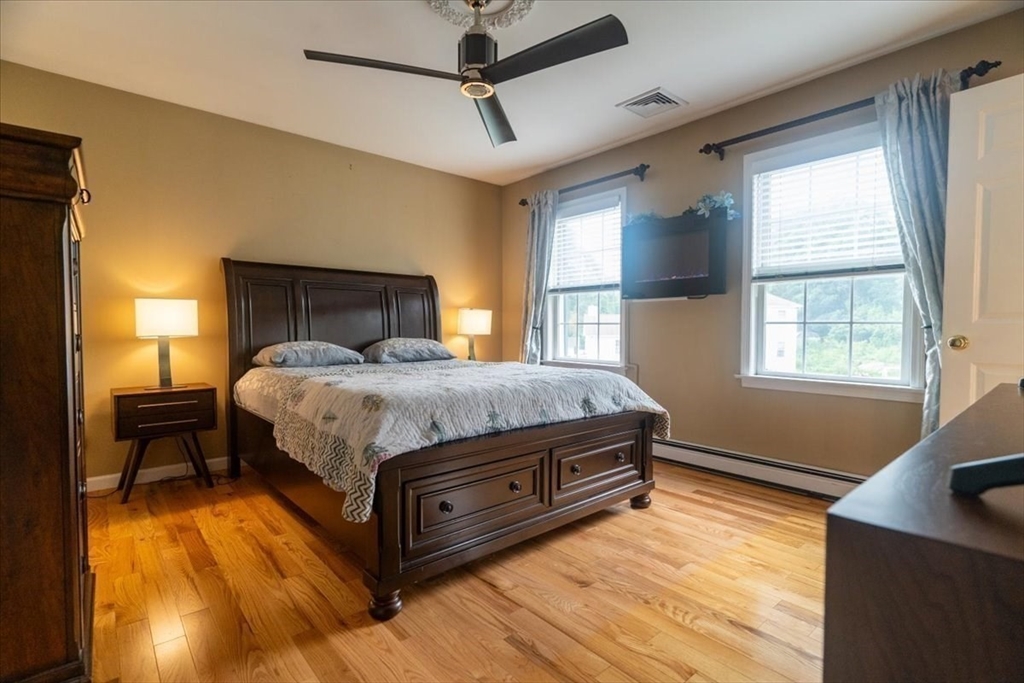 82 Hammersmith Drive Saugus, MA 01906 - Photo 21 of 42 a bedroom with a bed and window