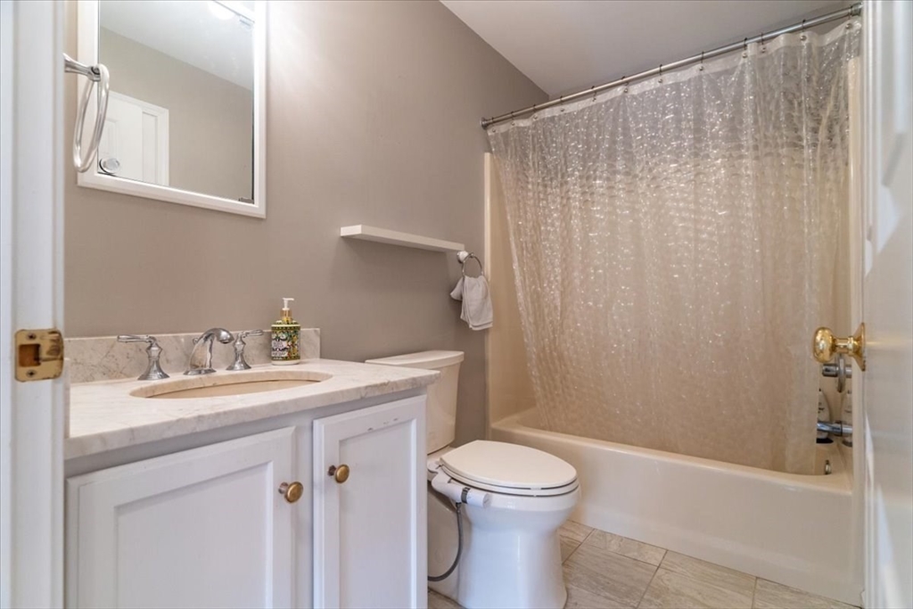 82 Hammersmith Drive Saugus, MA 01906 - Photo 30 of 42 a bathroom with a sink a toilet and shower