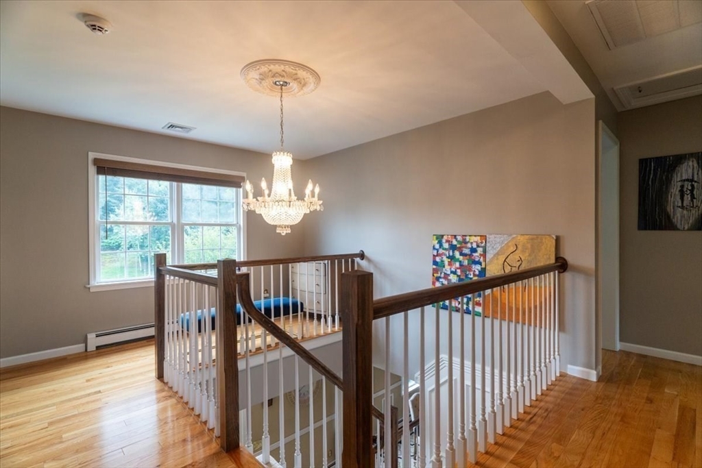 82 Hammersmith Drive Saugus, MA 01906 - Photo 33 of 42 a view of a balcony with wooden floor