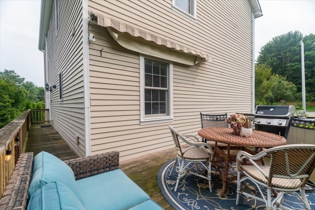 82 Hammersmith Drive Saugus, MA 01906 - Photo 38 of 42 a patio with table and chairs