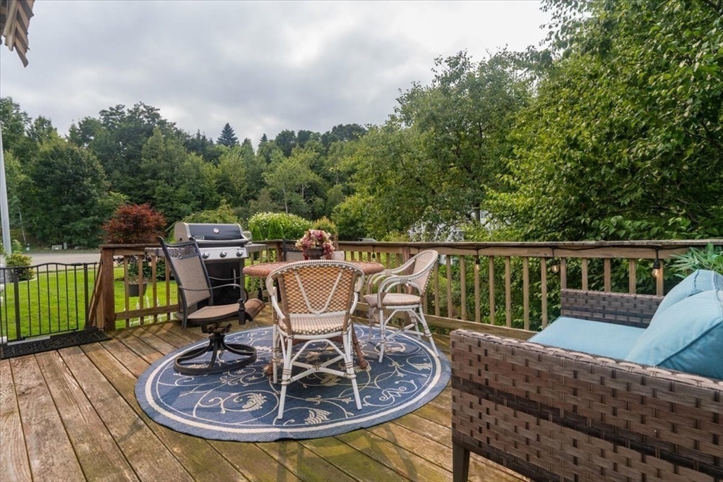 82 Hammersmith Drive Saugus, MA 01906 - Photo 39 of 42 a view of a chair and table on the deck