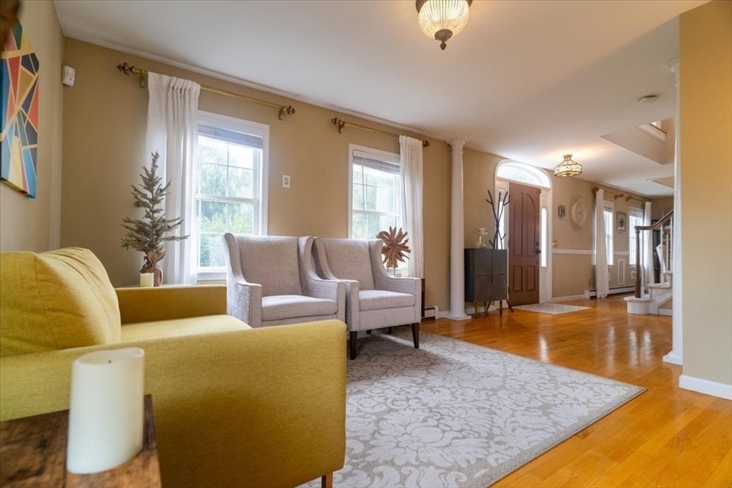 82 Hammersmith Drive Saugus, MA 01906 - Photo 4 of 42 a living room with furniture and a rug