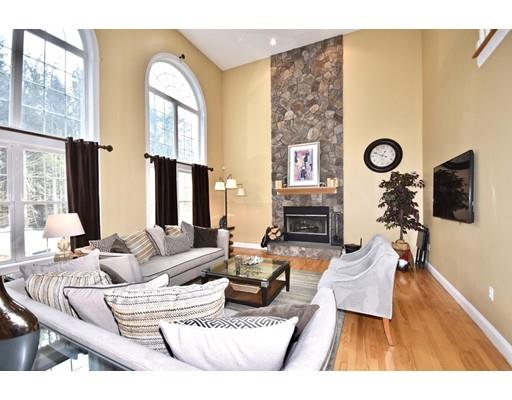 1109 Walnut Plain Road Rochester, MA 02770 - Photo 6 of 20 a living room with fireplace furniture and a large window