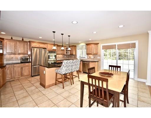 1109 Walnut Plain Road Rochester, MA 02770 - Photo 9 of 20 a dining room with furniture and a kitchen view