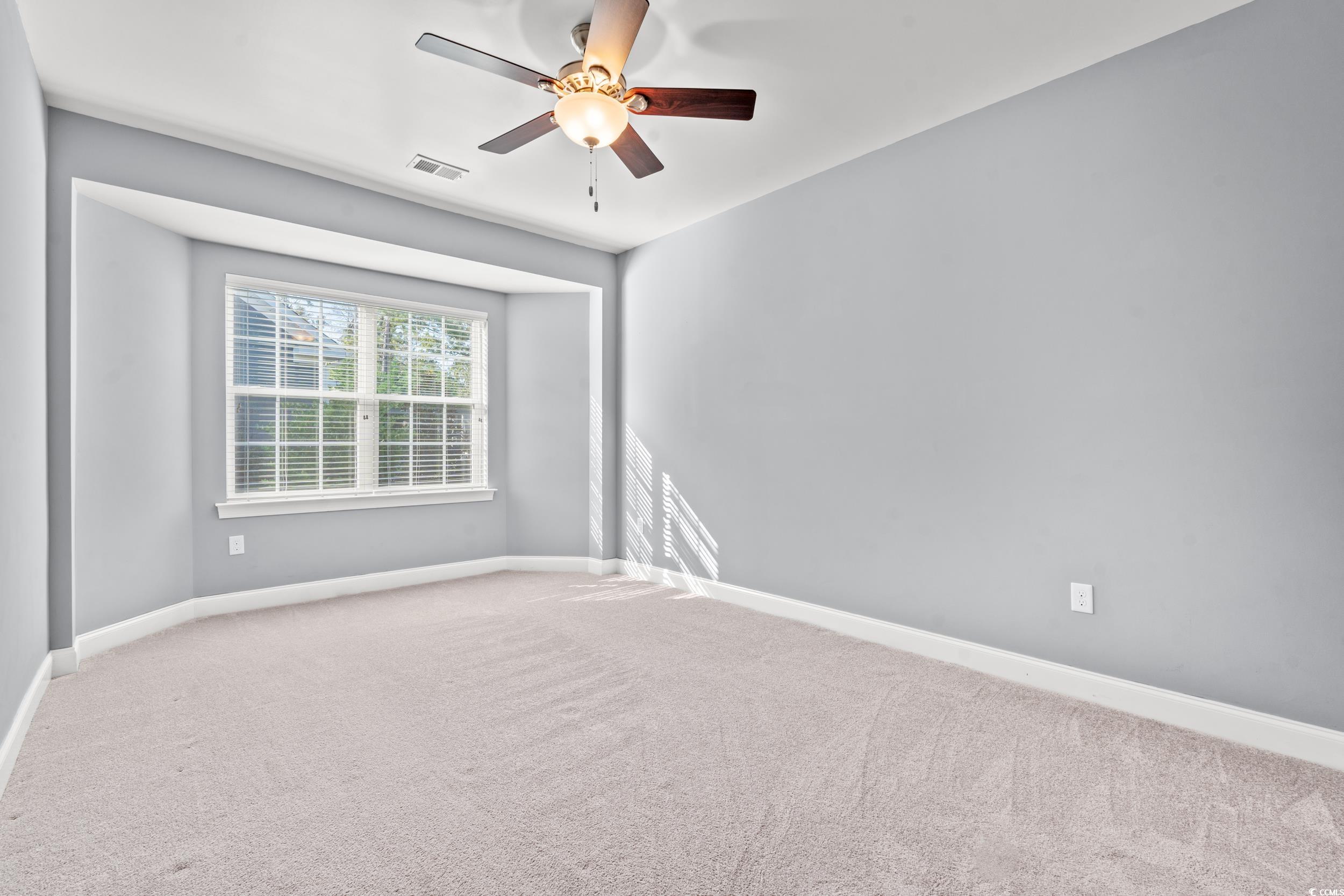 860 Tilly Lake Road Conway, SC 29526 - Photo 21 of 38 Guest Bedroom with carpet and ceiling fan