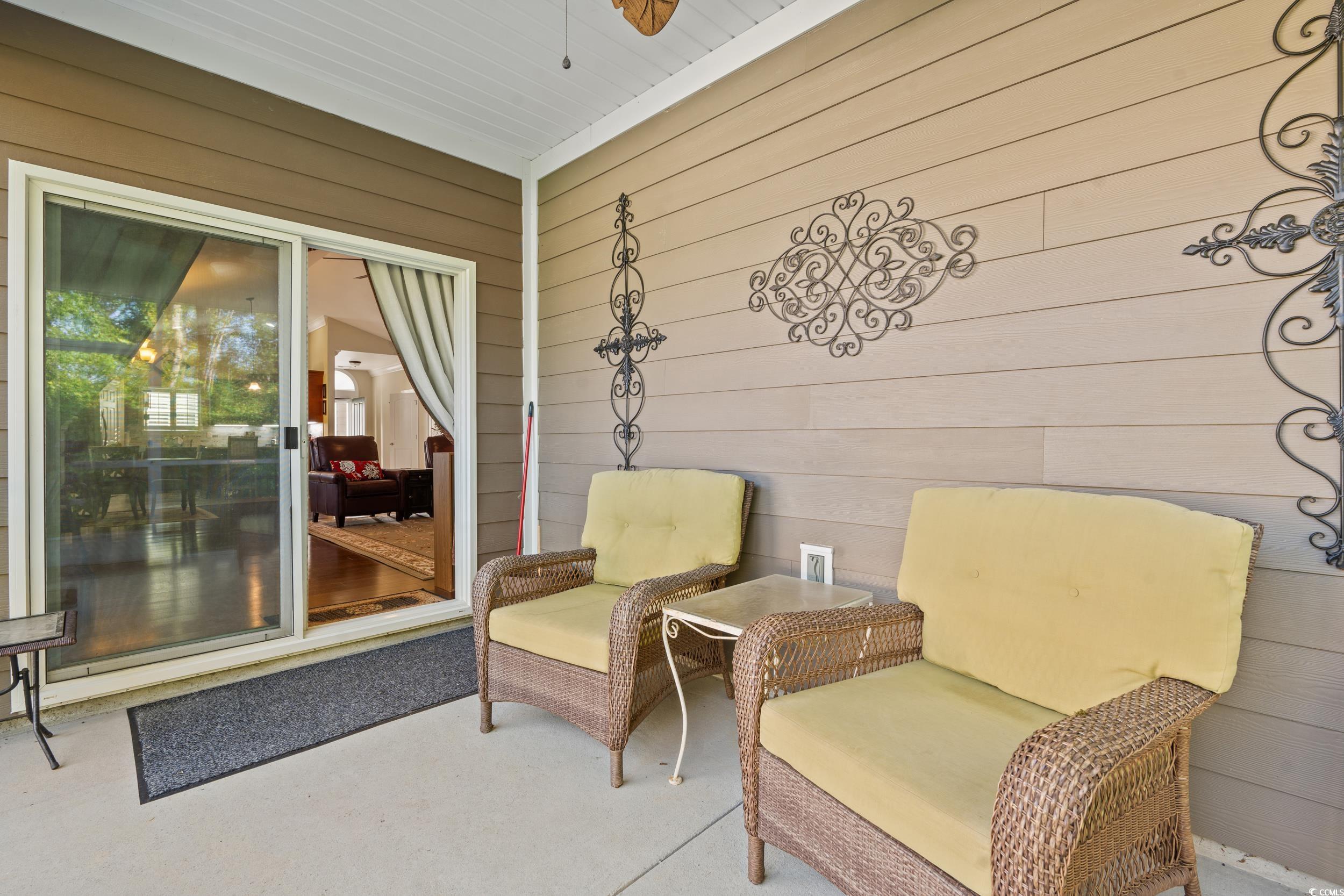 860 Tilly Lake Road Conway, SC 29526 - Photo 25 of 38 Living area with wood walls and ceiling fan