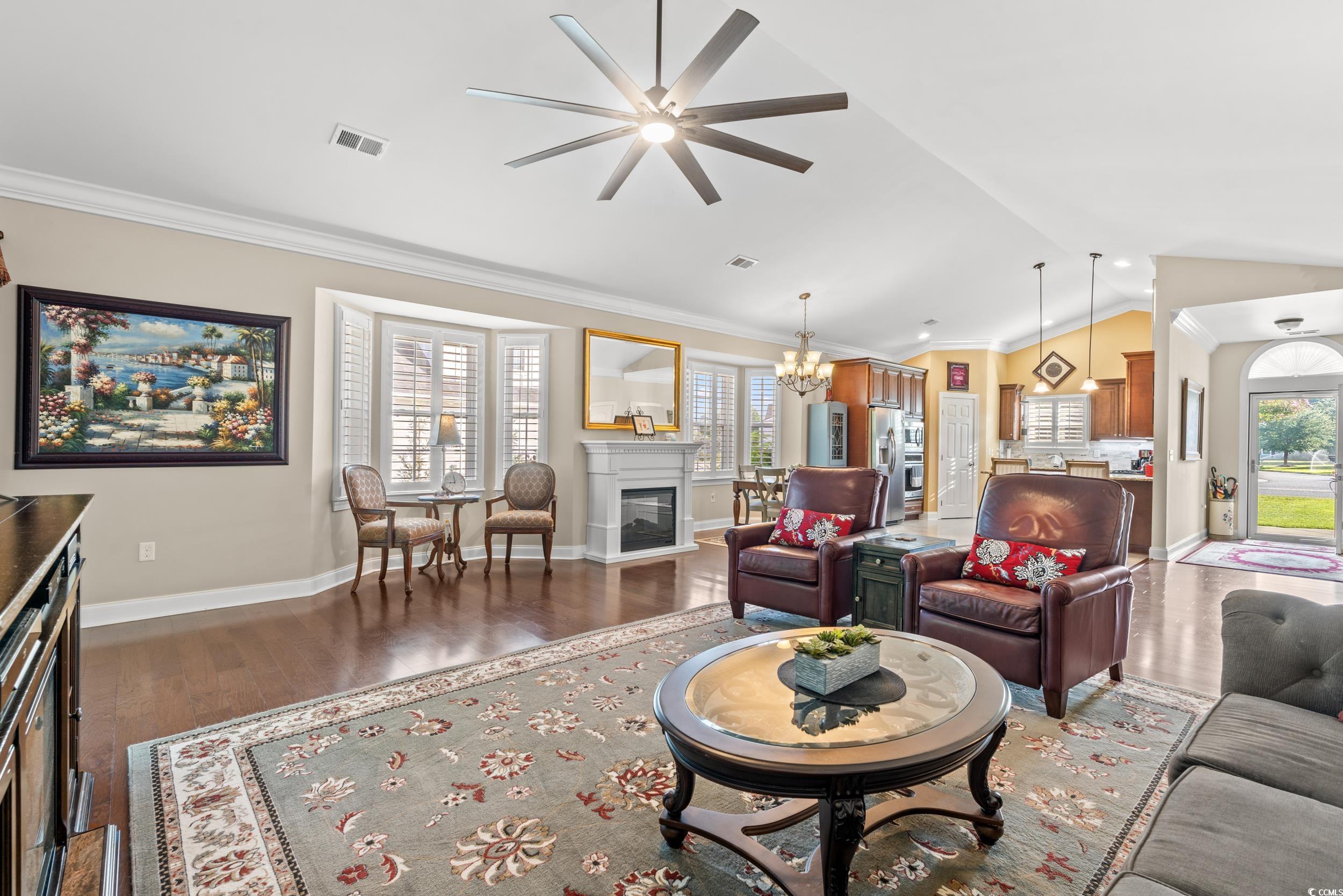860 Tilly Lake Road Conway, SC 29526 - Photo 8 of 38 Living room with ceiling fan with notable chandeli