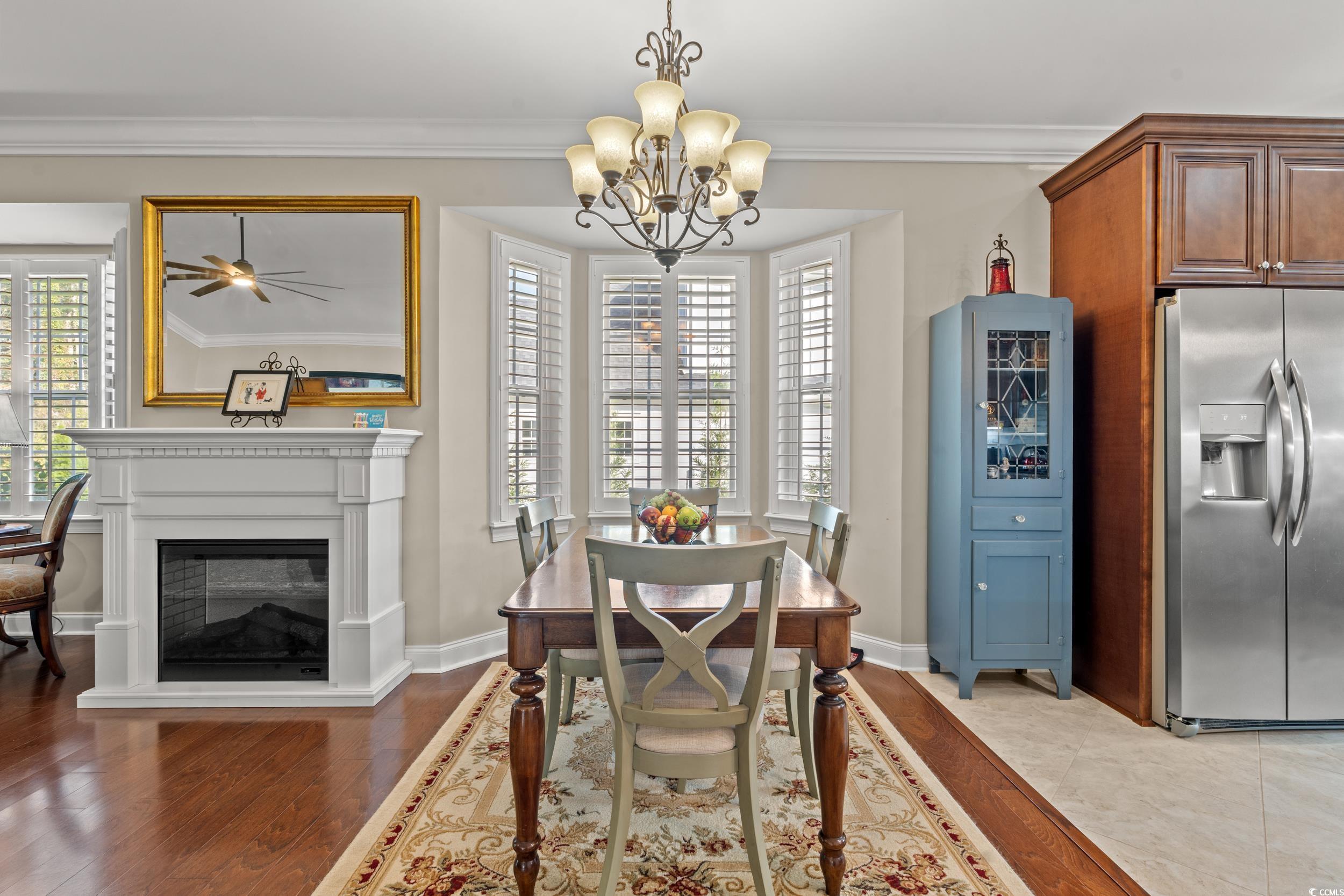 860 Tilly Lake Road Conway, SC 29526 - Photo 9 of 38 Dining space with crown molding, light hardwood /