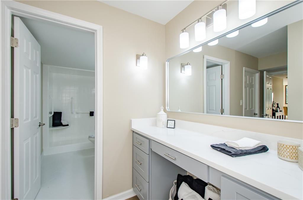 3530 Piedmont Road Northeast, Unit F5 Atlanta, GA 30305 - Photo 18 of 28 a bathroom with a sink and a mirror