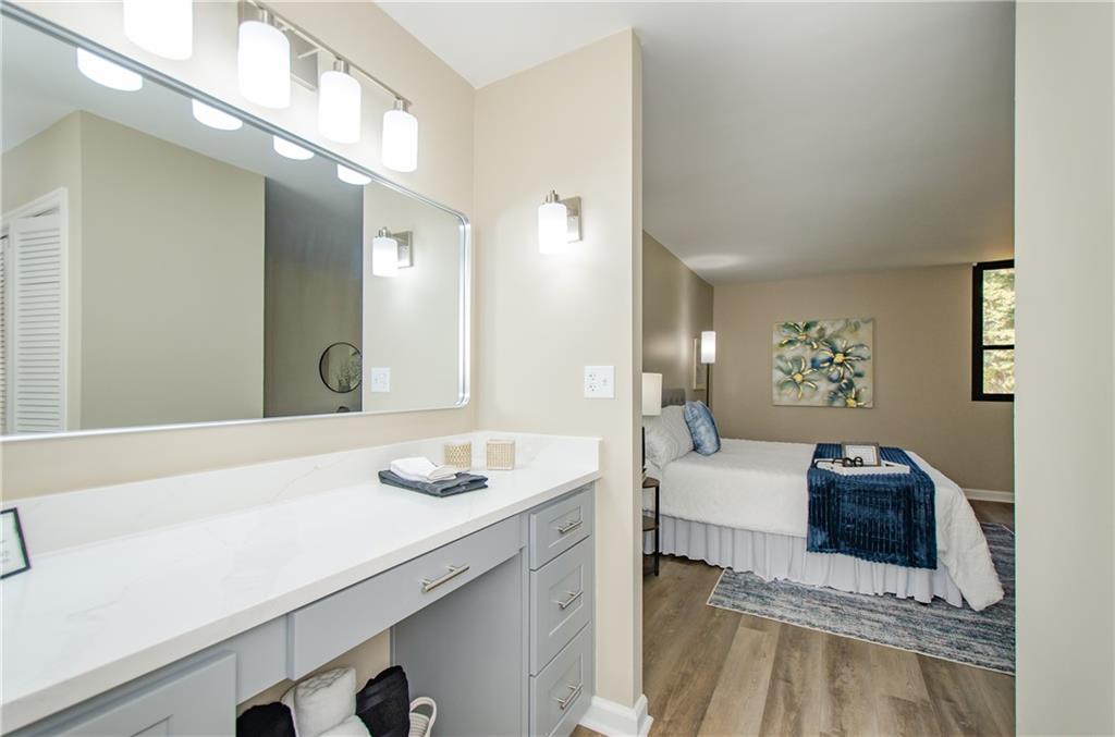 3530 Piedmont Road Northeast, Unit F5 Atlanta, GA 30305 - Photo 20 of 28 a en suite bathroom with a double vanity sink mirror and