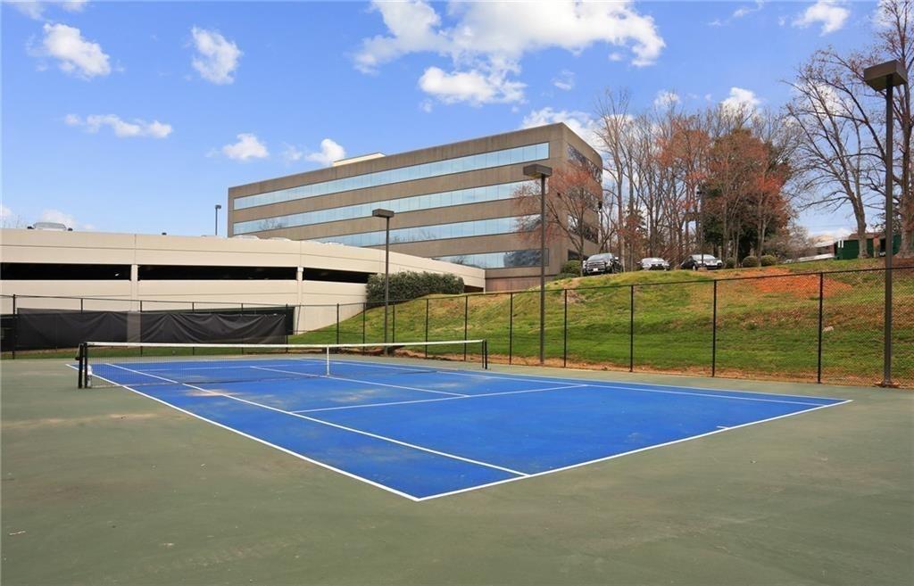 3530 Piedmont Road Northeast, Unit F5 Atlanta, GA 30305 - Photo 27 of 28 a view of an outdoor space and tennis court