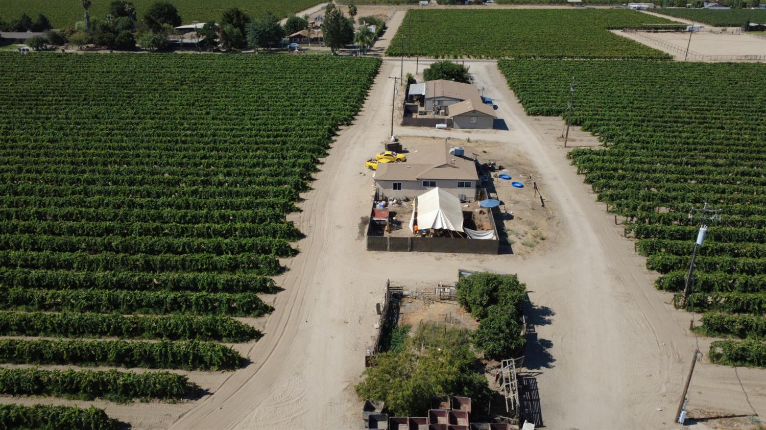 an aerial view of a house with outdoor space lake view and outdoor space