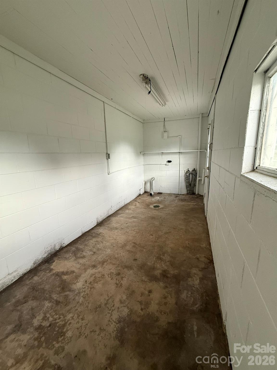 108 Fletcher Street Morganton, NC 28655 - Photo 24 of 29 a big room with wooden floor and windows