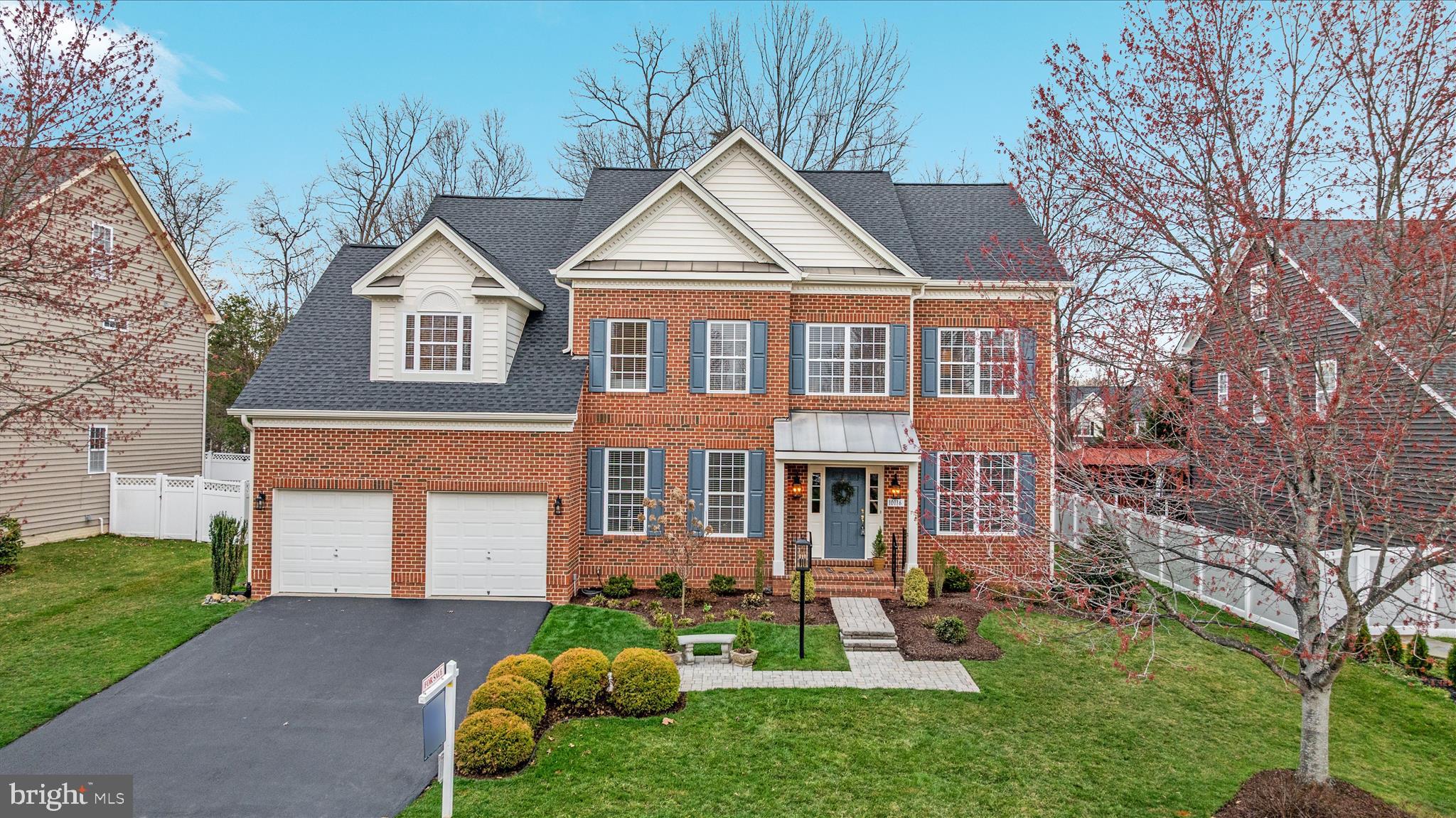 10116 Middlebrooks Terrace Nokesville, VA 20181 - Photo 1 of 78 a front view of a house with a yard and trees