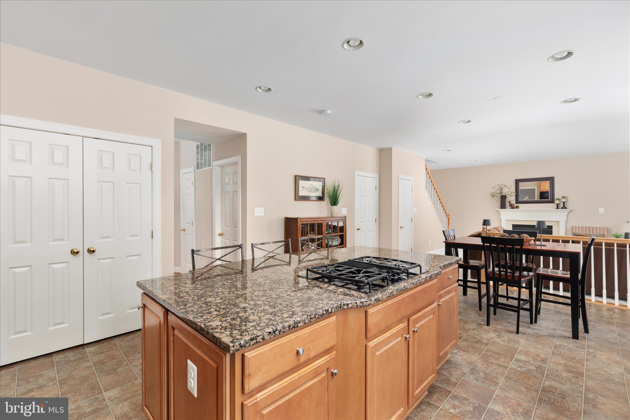 10116 Middlebrooks Terrace Nokesville, VA 20181 - Photo 17 of 78 a kitchen with a table and chairs in it