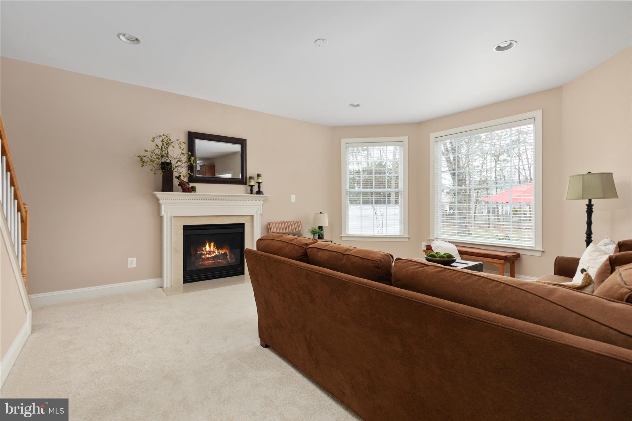 10116 Middlebrooks Terrace Nokesville, VA 20181 - Photo 25 of 78 a living room with furniture and a fireplace