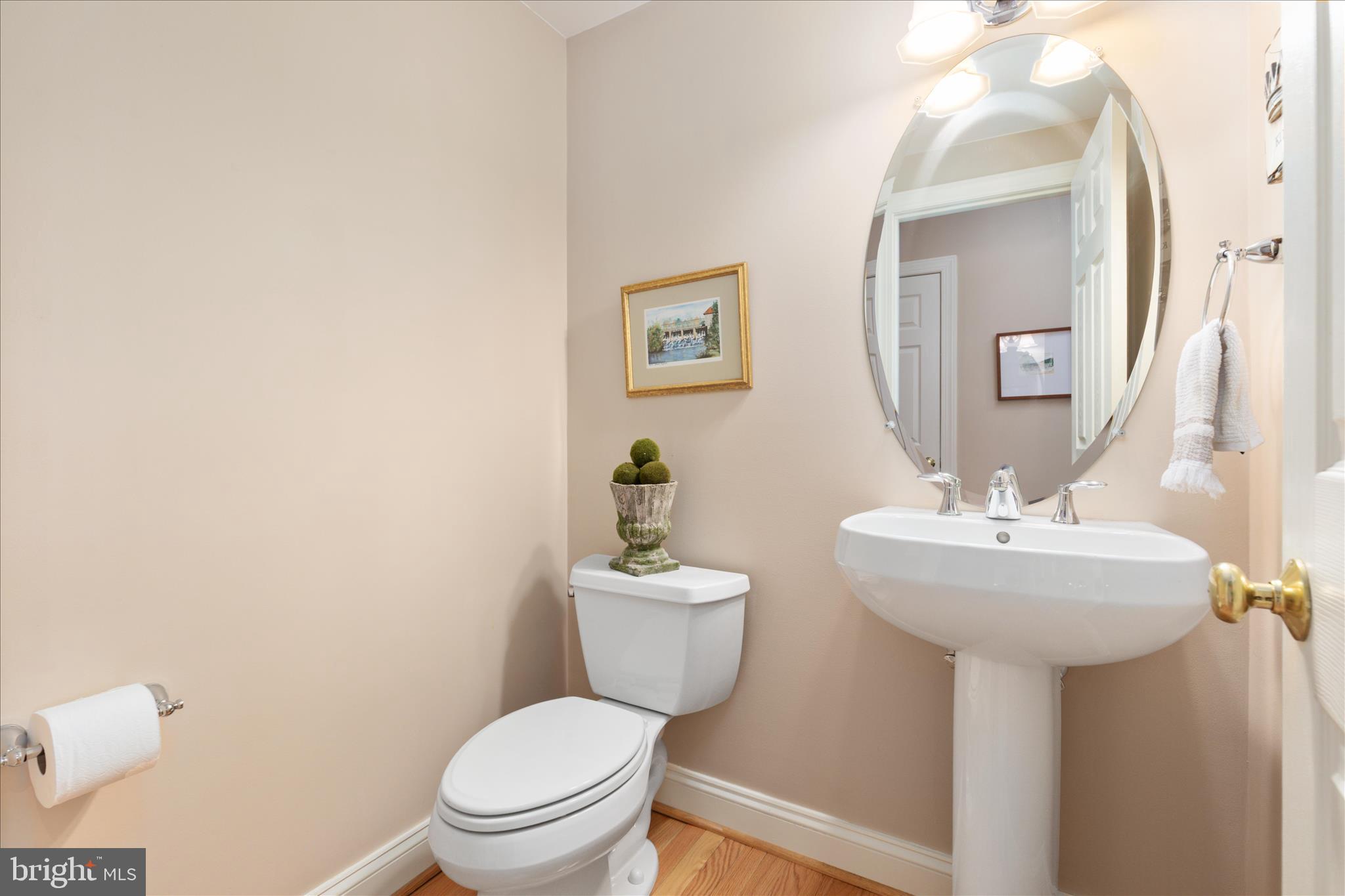 10116 Middlebrooks Terrace Nokesville, VA 20181 - Photo 27 of 78 a bathroom with a toilet sink and mirror