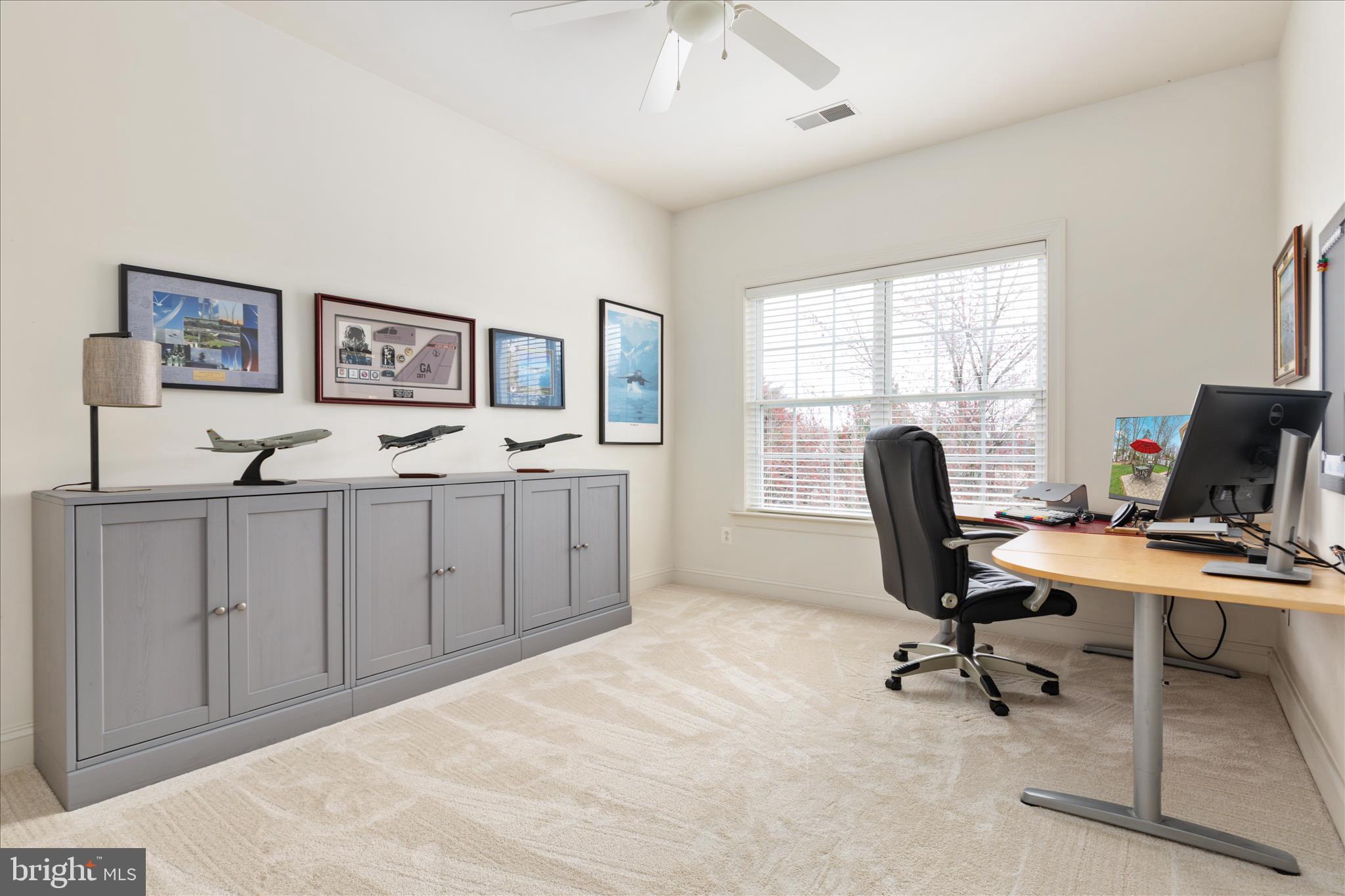 10116 Middlebrooks Terrace Nokesville, VA 20181 - Photo 31 of 78 a view of a workspace with furniture and a window