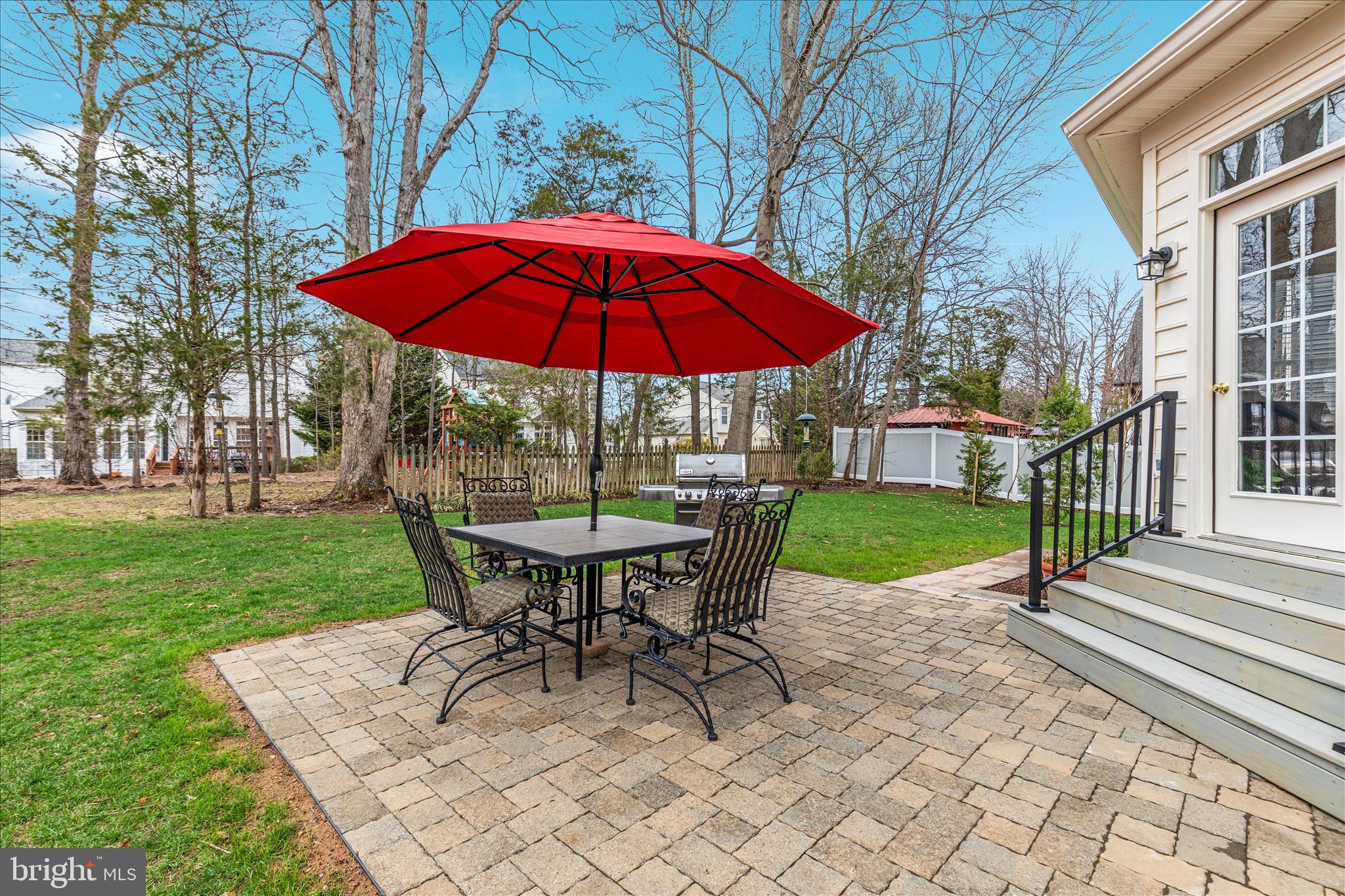 10116 Middlebrooks Terrace Nokesville, VA 20181 - Photo 50 of 78 a view of a house with backyard sitting area and garden