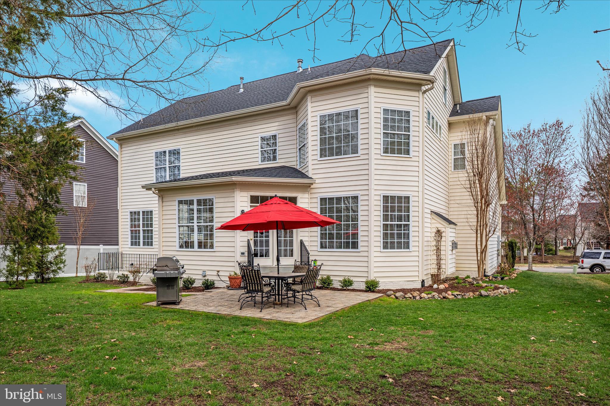 10116 Middlebrooks Terrace Nokesville, VA 20181 - Photo 5 of 78 a front view of a house with garden and chairs