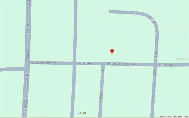 a view of a room with utility area and a refrigerator