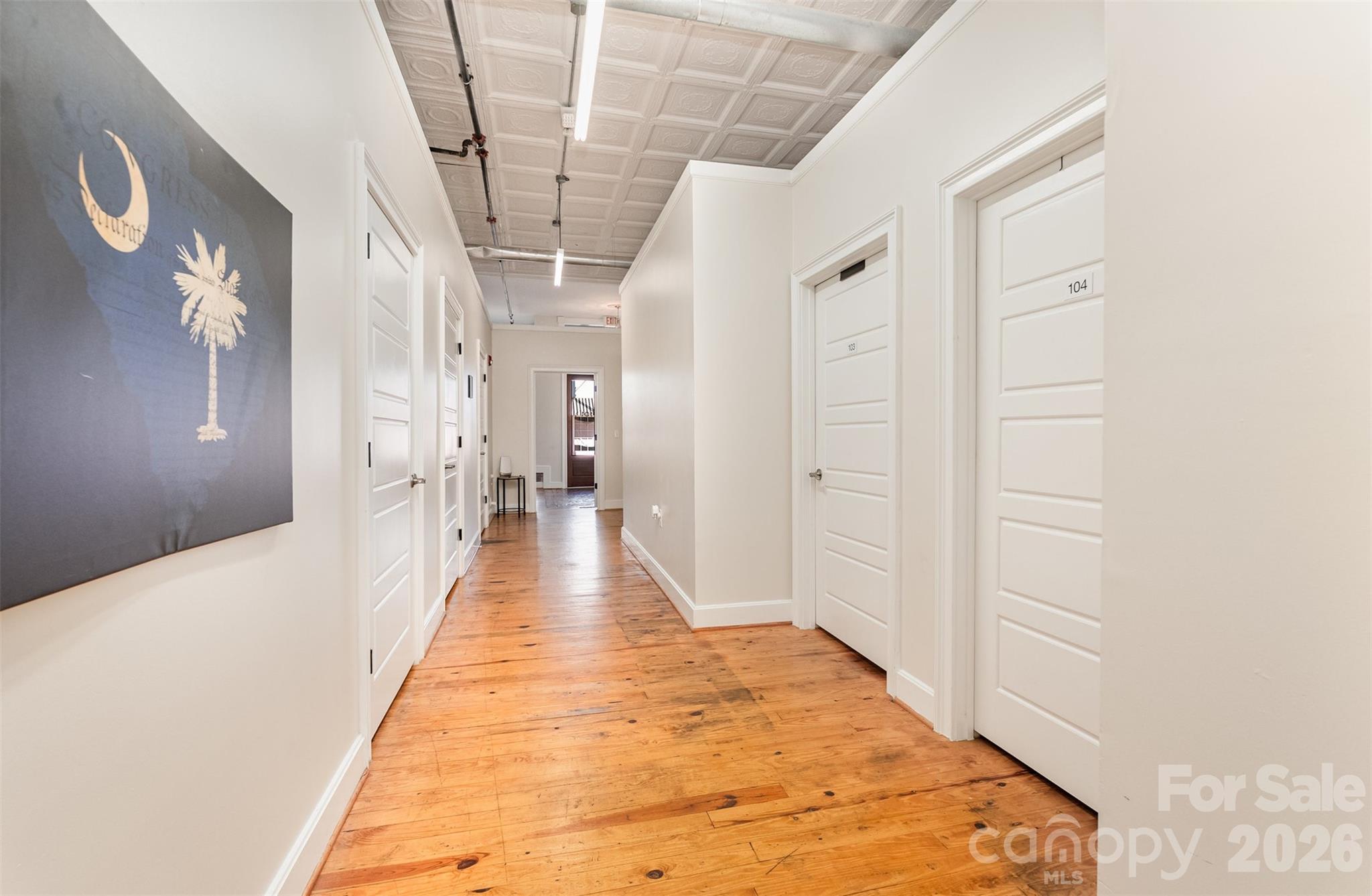 101 West Main Street Union, SC 29379 - Photo 16 of 29 a view of a hallway with wooden floor and staircase