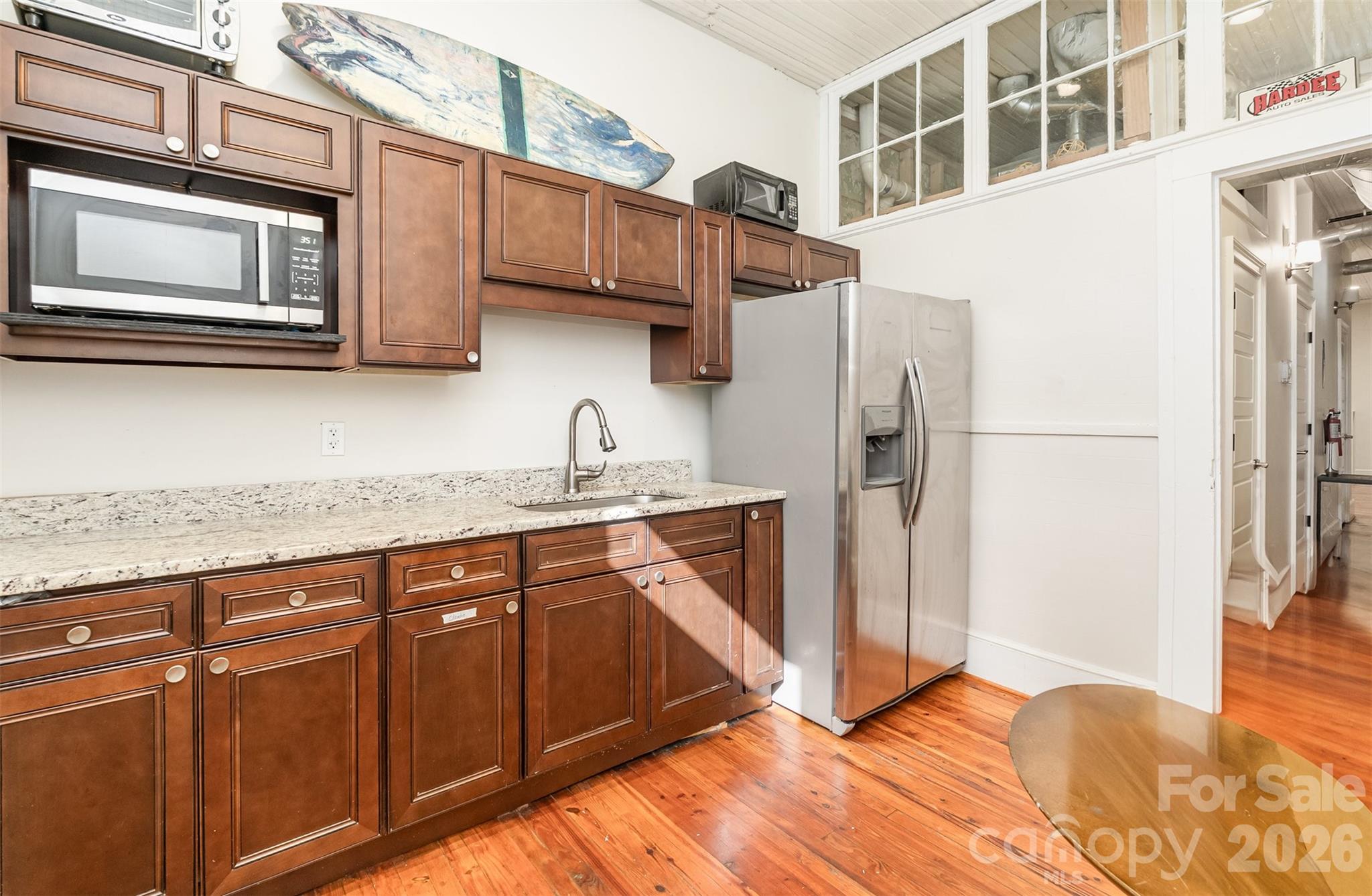 101 West Main Street Union, SC 29379 - Photo 7 of 29 a kitchen with stainless steel appliances granite countertop a refrigerator and microwave