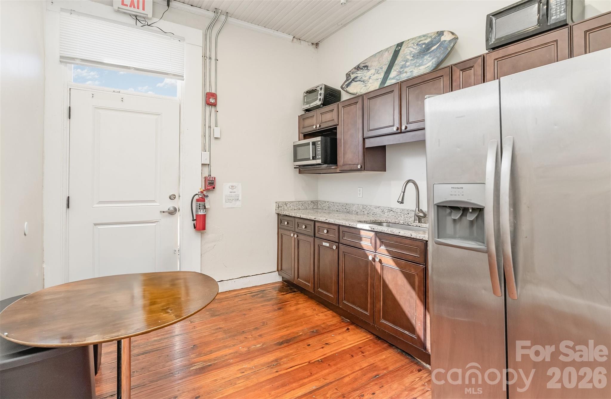 101 West Main Street Union, SC 29379 - Photo 9 of 29 a kitchen with stainless steel appliances granite countertop a refrigerator a stove and a sink