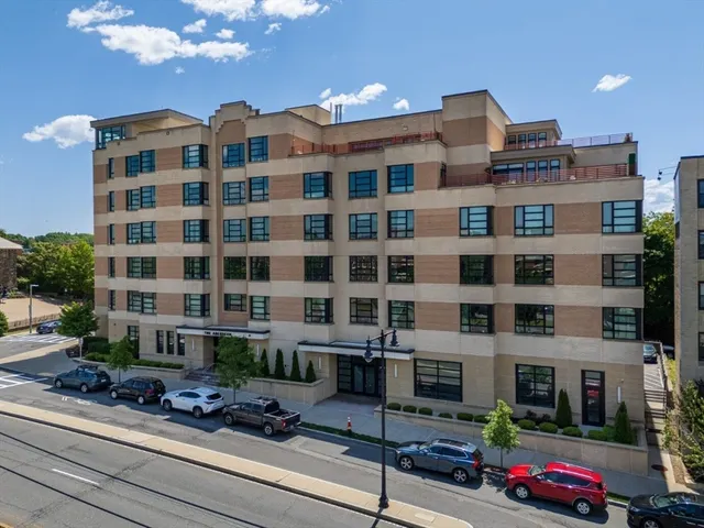 a front view of a building with street view and glass windows