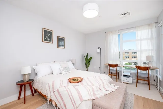 a bedroom with furniture and a table