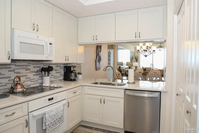 a bedroom with a bed and a lamp