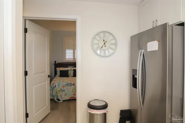 a bathroom with a sink vanity mirror and toilet