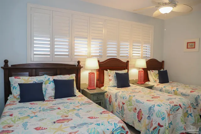 a bed room with a bed and a chair