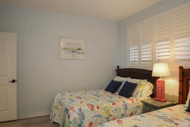 a bedroom with furniture and a flat screen tv